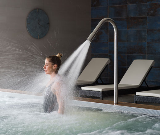 Image of lady relaxing in the hydro pool at David Lloyd Chigwell